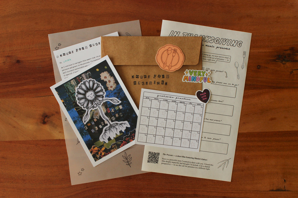 Collection of stationery items including a card, envelope, and printed sheets on a wooden surface.